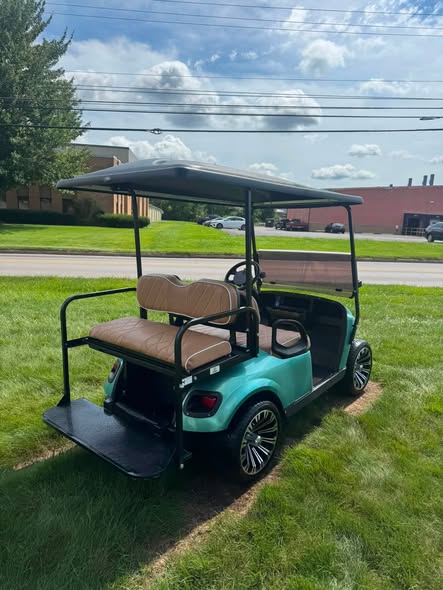 rear flip seat on the 2017 EZGO TXT gas golf cart folded down