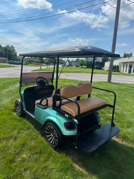2017 EZGO TXT gas cart rear view showing taillights and flip seat