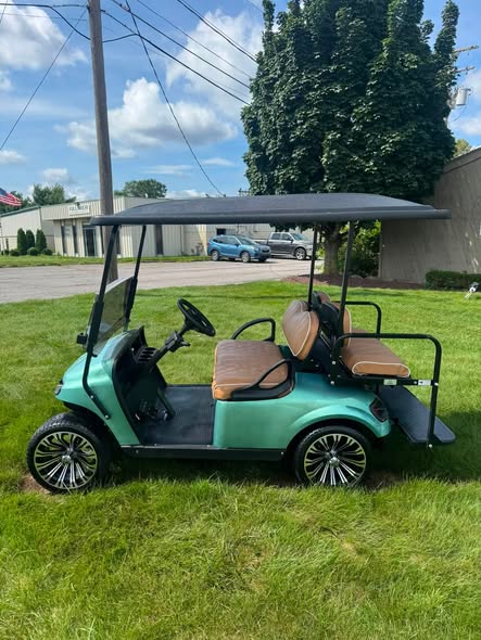 side profile of the 2017 EZGO TXT gas golf cart with extended roof