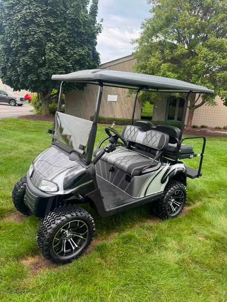 charcoal-ezgo-rxv-gas-golf-cart-1 charcoal EZGO RXV gas golf cart lifted with silver swirl graphics