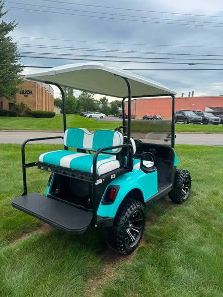 lifted-teal-ezgo-rxv-gas-cart-3 rear flip seat folded on the lifted teal EZGO RXV gas cart