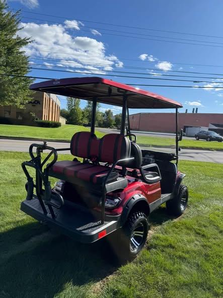 red ICON i40L lifted cart rear angle showing all-terrain tires
