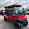 red-2023-epic-e60l-6-passenger-golf-cart-2 red 2023 Epic E60L front view with utility basket and glass windshield
