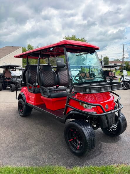 red-2023-epic-e60l-6-passenger-golf-cart-2 red 2023 Epic E60L front view with utility basket and glass windshield