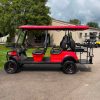 red-2023-epic-e60l-6-passenger-golf-cart-5 side profile of red 2023 Epic E60L with six diamond-stitched seats