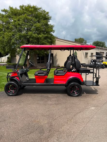 red-2023-epic-e60l-6-passenger-golf-cart-5 side profile of red 2023 Epic E60L with six diamond-stitched seats
