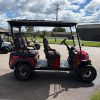 red ICON i40FX golf cart side profile showing four forward seats