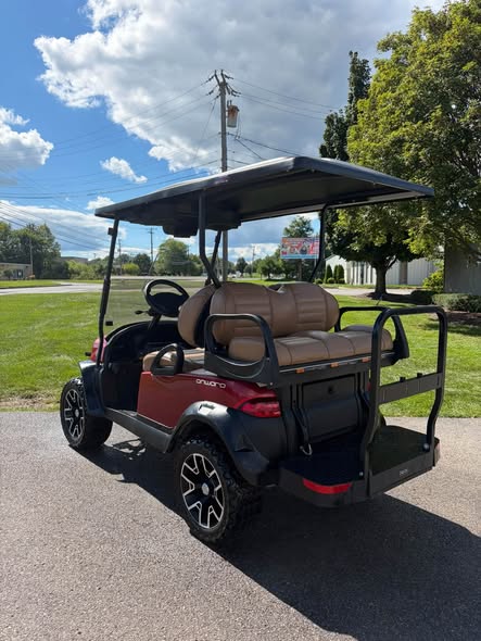 red-club-car-onward-48v-electric-4 rear view of lifted red Club Car Onward electric cart