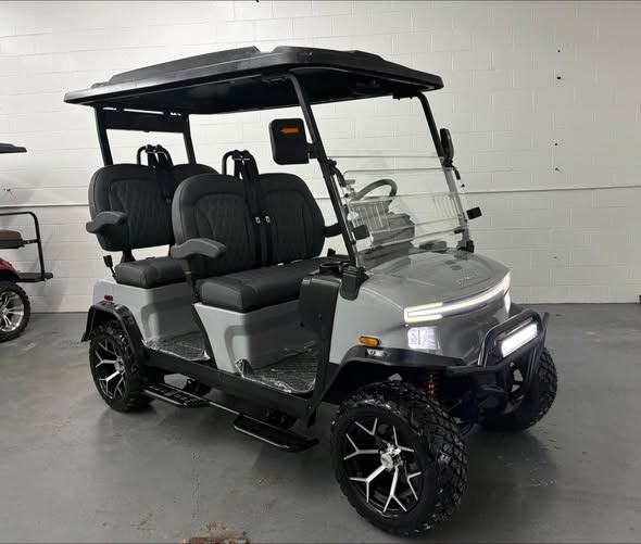 silver Denago Rover XL golf cart side angle with lifted all-terrain tires