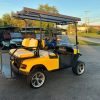 yellow-ezgo-express-s4-golf-cart-2 yellow EZGO Express S4 cart rear seat and footrest on our lot