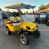 yellow-ezgo-express-s4-golf-cart-3 front view of the lifted yellow EZGO Express S4 golf cart